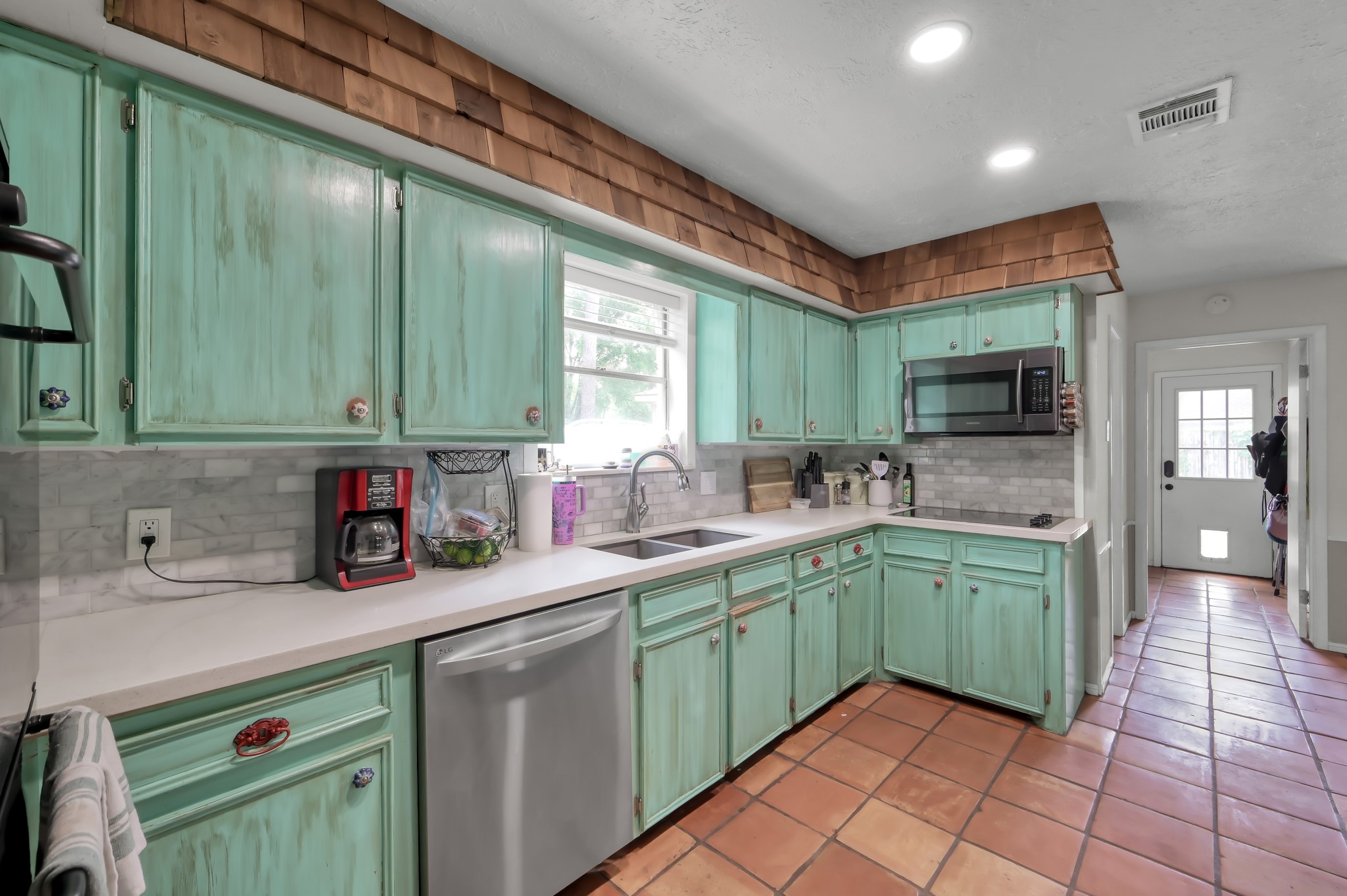25610 Walnut Grove Circle Spring, TX 77380 - Photo 7 of 29 a kitchen with a sink and cabinets