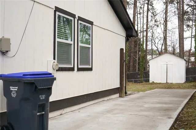 a view of backyard with seating space
