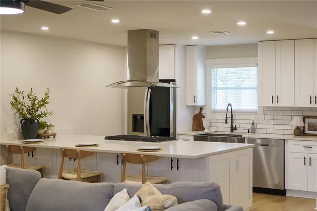 a bathroom with a sink double vanity granite and a mirror