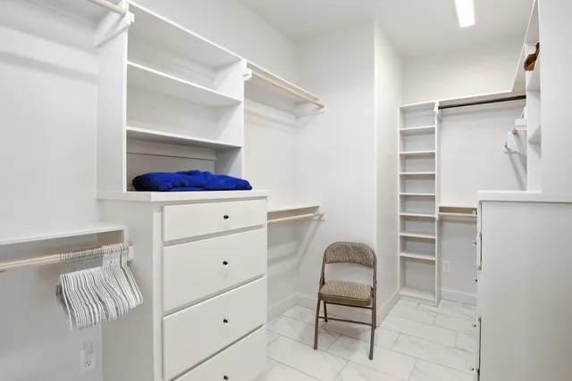 a room with a chair and closet