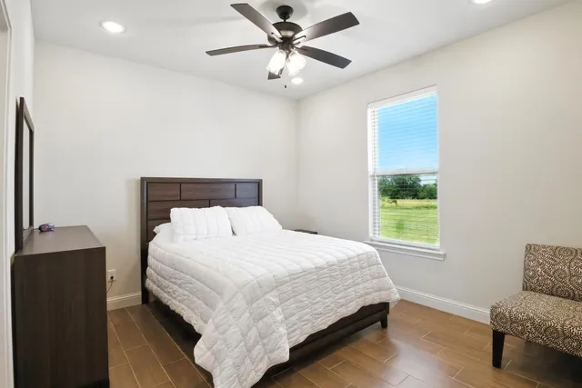 a bedroom with a bed and a couch