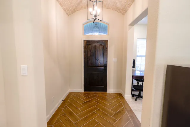 a view of bedroom with wooden floor