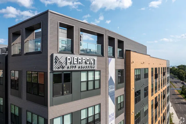 a front view of a building with glass windows