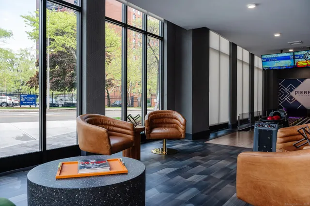 a living room with furniture and a large window