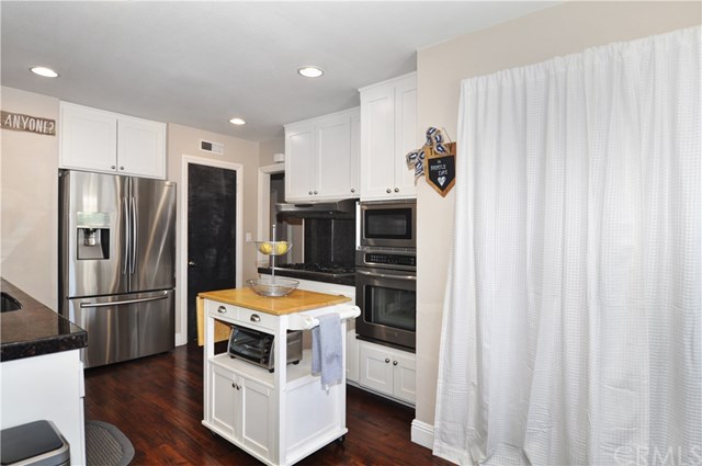 2612 Redlands Drive Costa Mesa, CA 92627 - Photo 11 of 30 a kitchen with stainless steel appliances a refrigerator and a stove