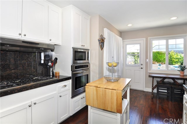 2612 Redlands Drive Costa Mesa, CA 92627 - Photo 13 of 30 a kitchen with stainless steel appliances a stove a sink and a refrigerator