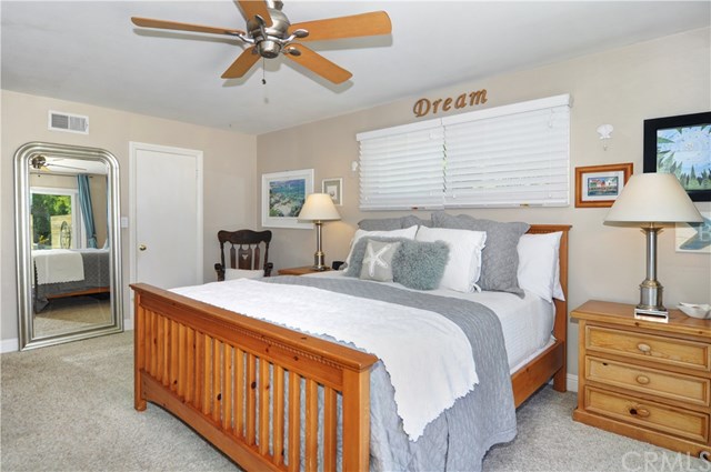 2612 Redlands Drive Costa Mesa, CA 92627 - Photo 17 of 30 a bed room with a bed and a lamp