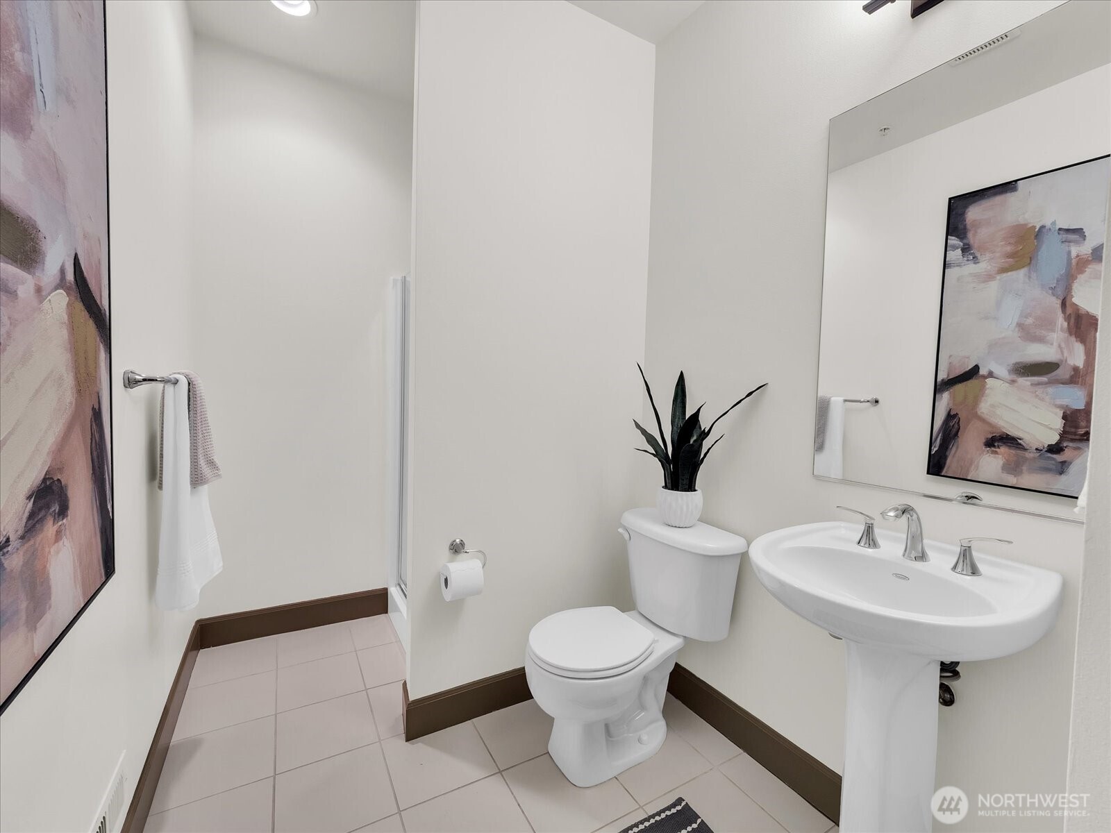 2115 201st Place Southeast, Unit K2 Bothell, WA 98012 - Photo 10 of 28 a bathroom with a toilet sink and mirror
