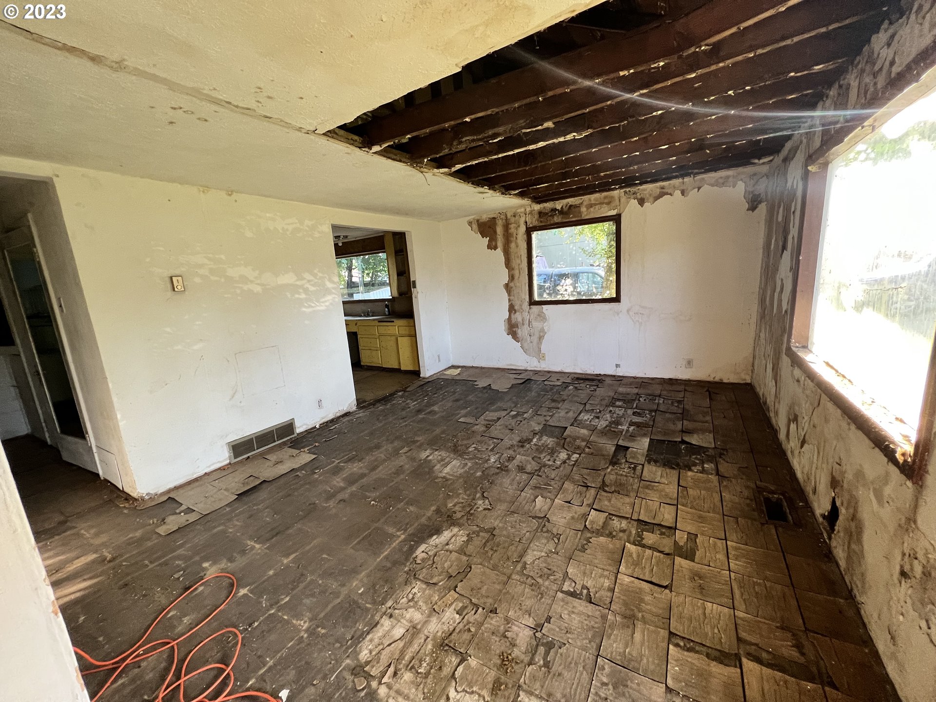 16920 East Burnside Street Portland, OR 97233 - Photo 3 of 8 a view of empty room with wooden floor