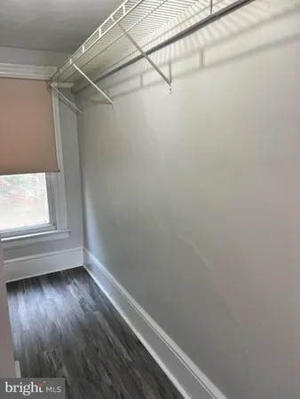 a view of a small space with racks on the wall
