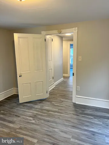a view of wooden floor in an empty room