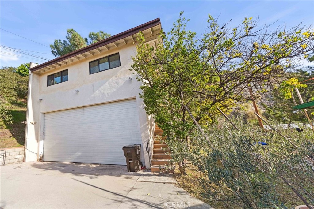 a house with a tree in front of it