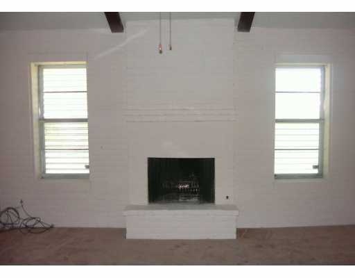 101 Barracuda Drive Portland, TX 78374 - Photo 3 of 5 a living room with a fireplace and a window