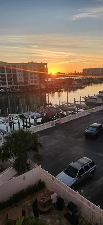 a view of a lake with a car parked