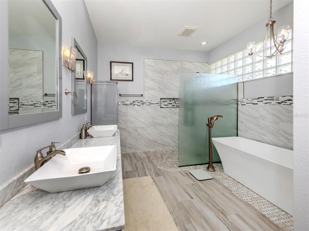 757 Pond Lily Way Venice, FL 34293 - Photo 30 of 53 a bathroom with a sink and a mirror