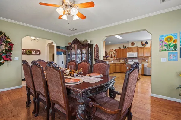 a view of a dining room with furniture and wooden floor