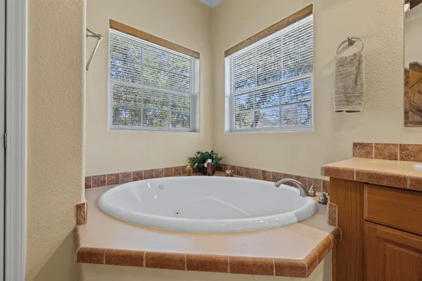 a bathroom with a tub and sink