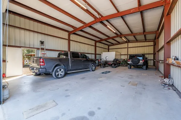 a view of parking garage with cars