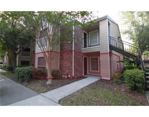 2201 Metropolitan Way, Unit 1414 Orlando, FL 32839 - Photo 1 of 1 a view of a brick house with a yard
