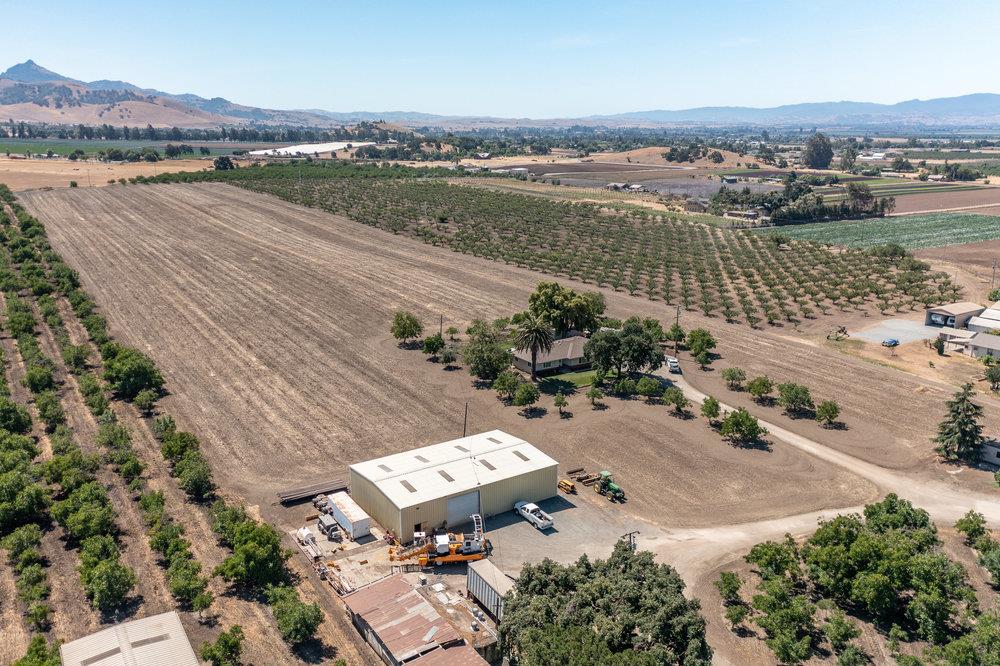 1177 Orchard Road Hollister, CA 95023 - Photo 1 of 79 an aerial view of a city with mountains