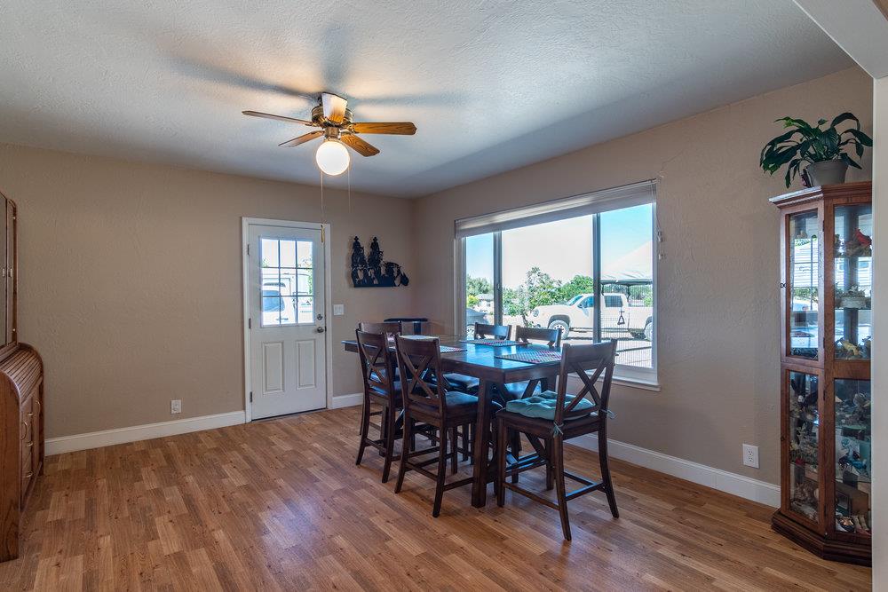 1177 Orchard Road Hollister, CA 95023 - Photo 16 of 79 a view of a dining room with furniture window and wooden floor