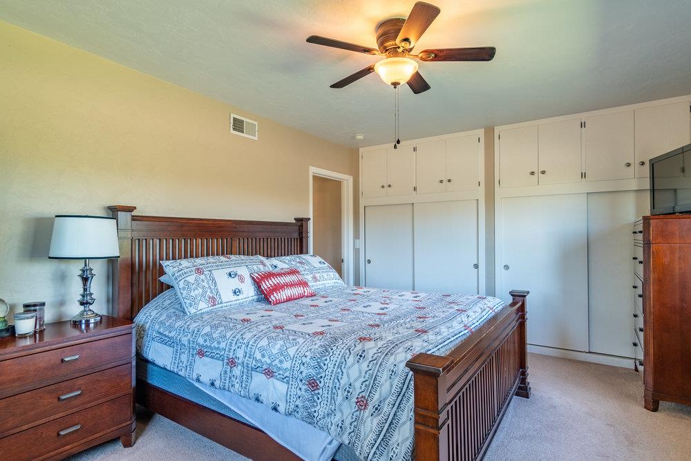 1177 Orchard Road Hollister, CA 95023 - Photo 27 of 79 a bedroom with a large bed and a lamp