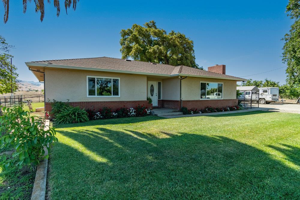 1177 Orchard Road Hollister, CA 95023 - Photo 4 of 79 a front view of a house with a garden