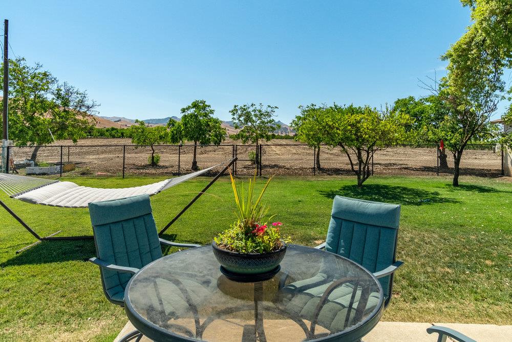 1177 Orchard Road Hollister, CA 95023 - Photo 33 of 79 a view of a swimming pool with a garden and plants