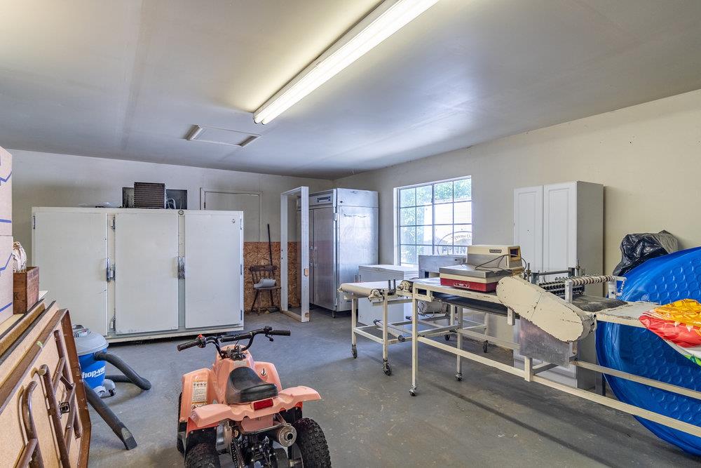1177 Orchard Road Hollister, CA 95023 - Photo 40 of 79 a living room with furniture a window and gym equipment
