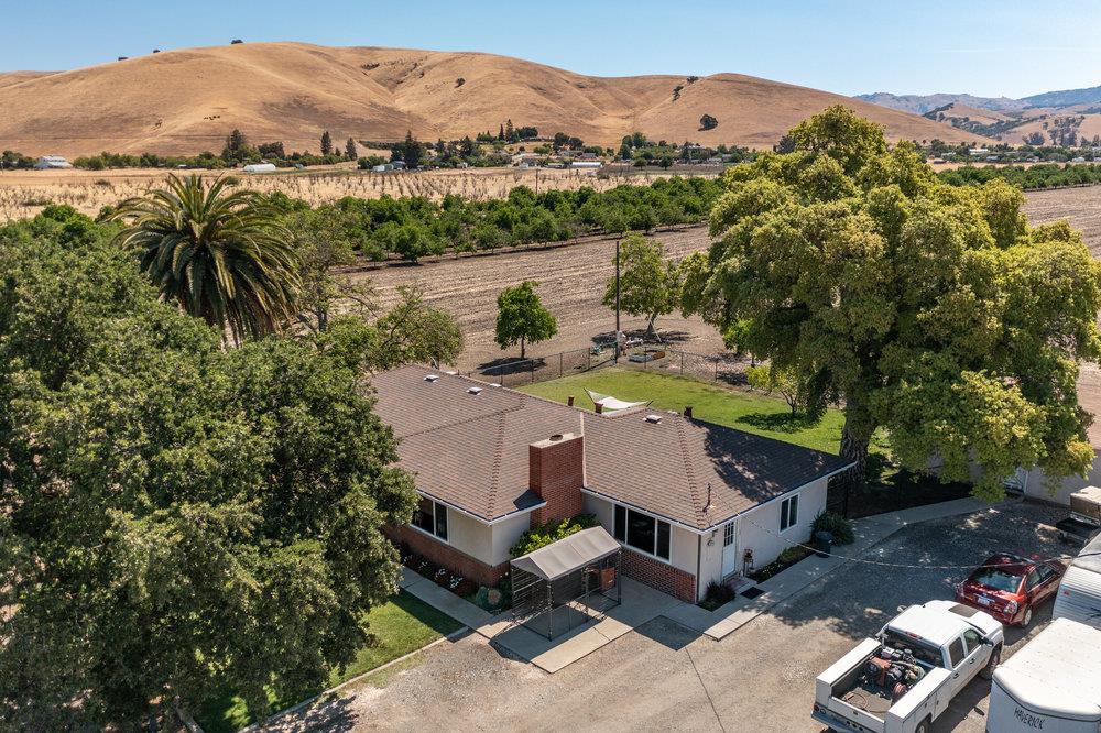 1177 Orchard Road Hollister, CA 95023 - Photo 55 of 79 a view of a house with a yard and mountain view