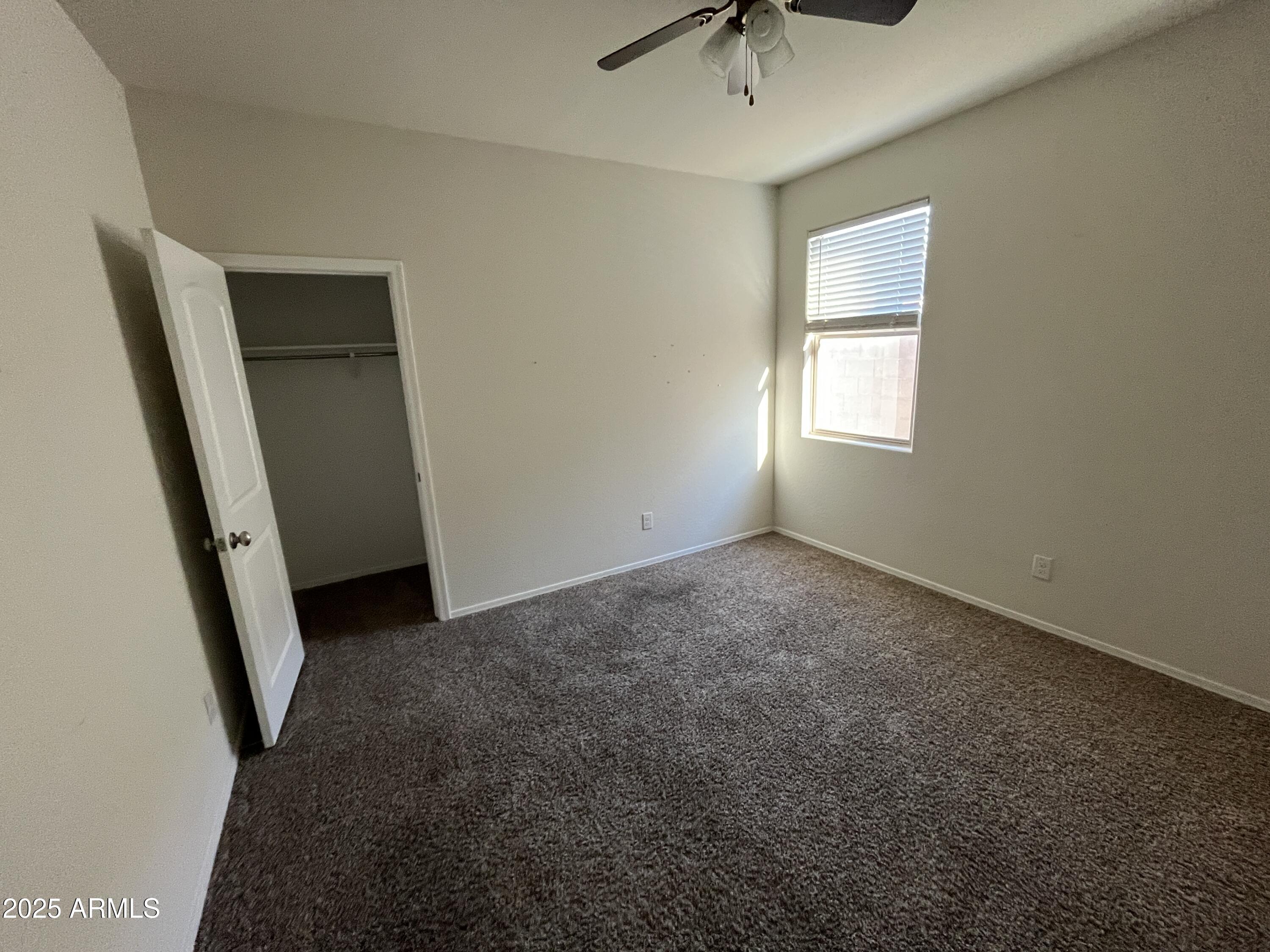 30968 West Picadilly Road Buckeye, AZ 85396 - Photo 14 of 21 an empty room with a window