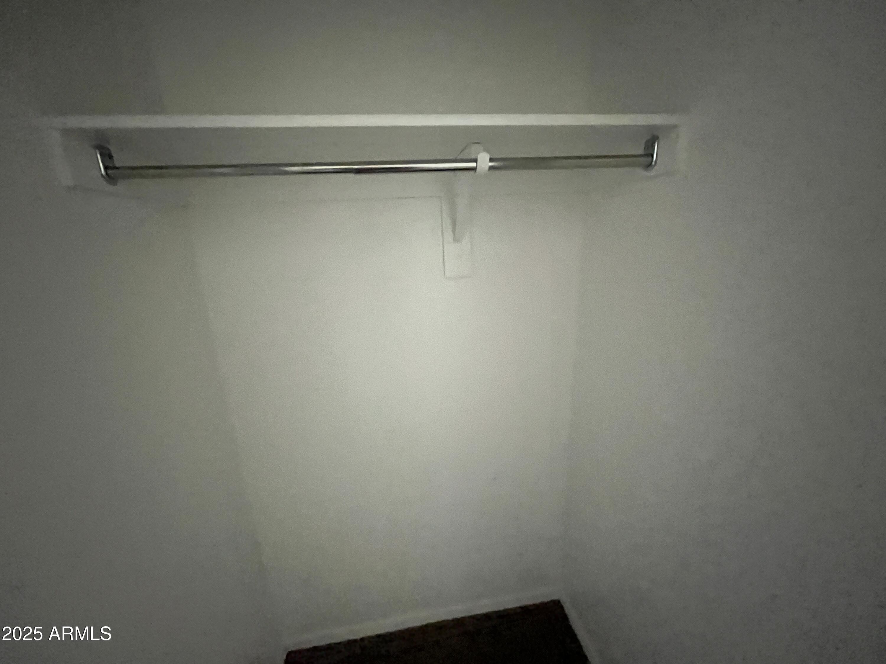 30968 West Picadilly Road Buckeye, AZ 85396 - Photo 16 of 21 a view of a room with racks on the wall