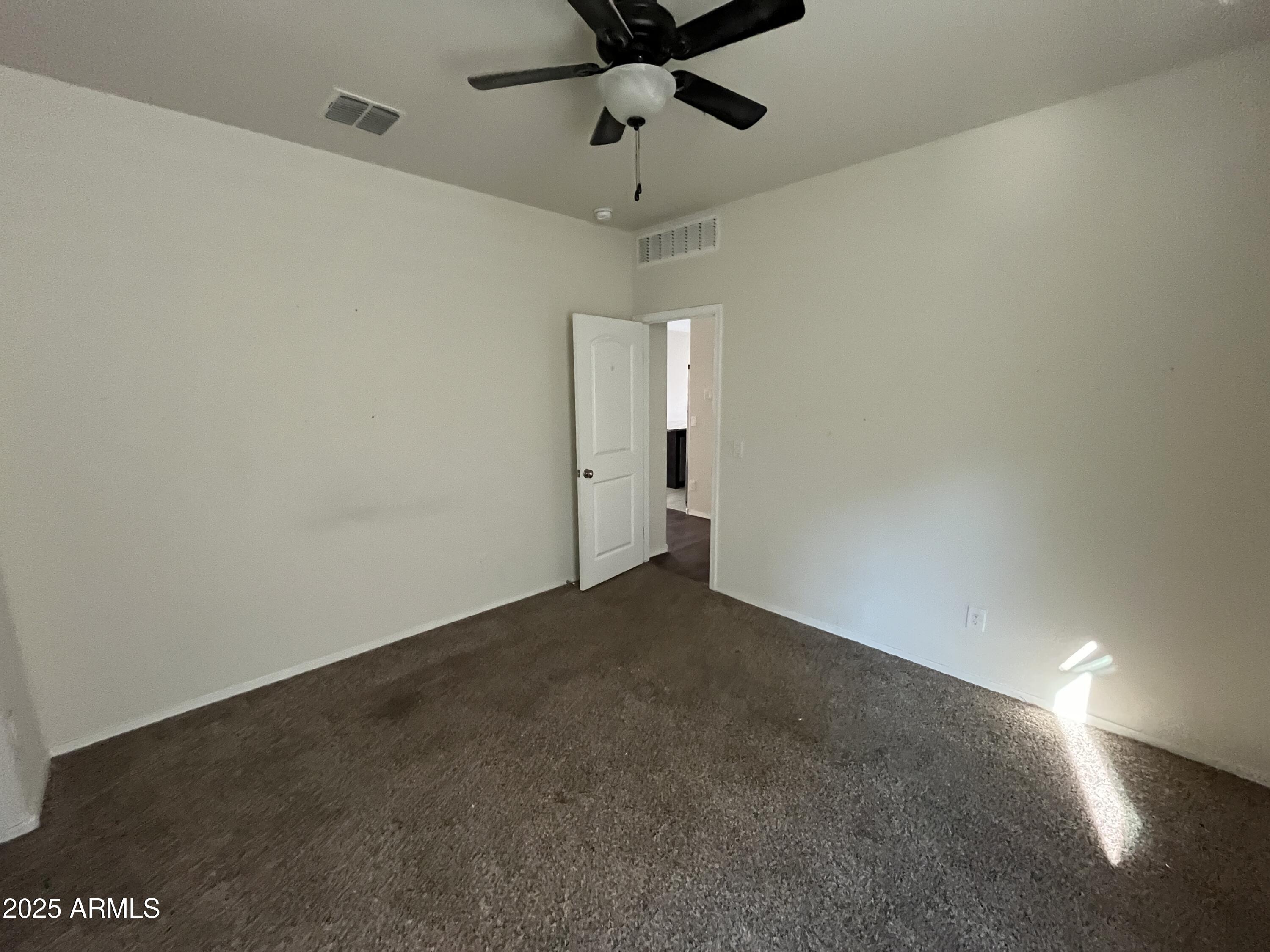 30968 West Picadilly Road Buckeye, AZ 85396 - Photo 18 of 21 a view of an empty room with a window