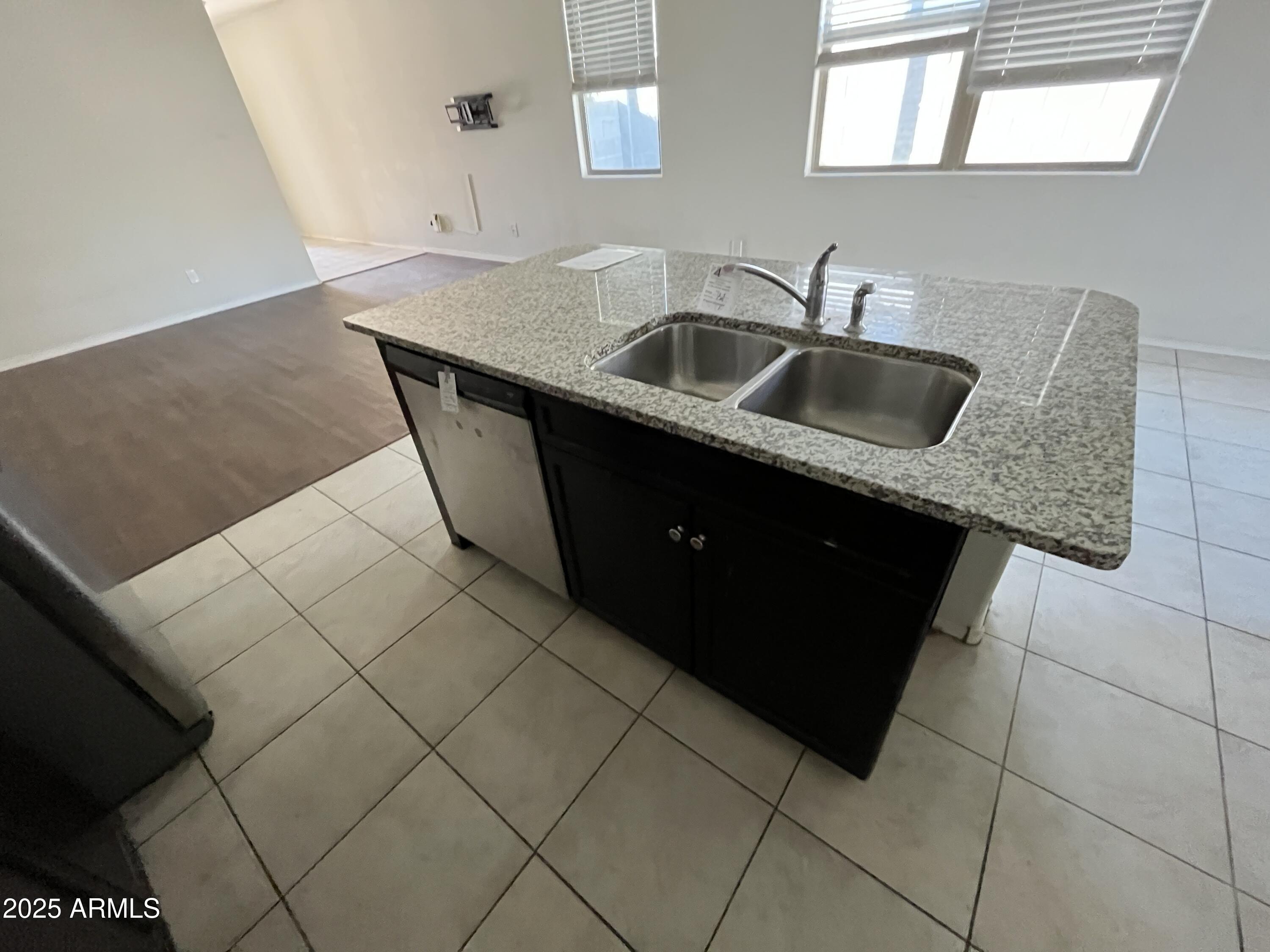 30968 West Picadilly Road Buckeye, AZ 85396 - Photo 7 of 21 a kitchen with a sink and cabinets