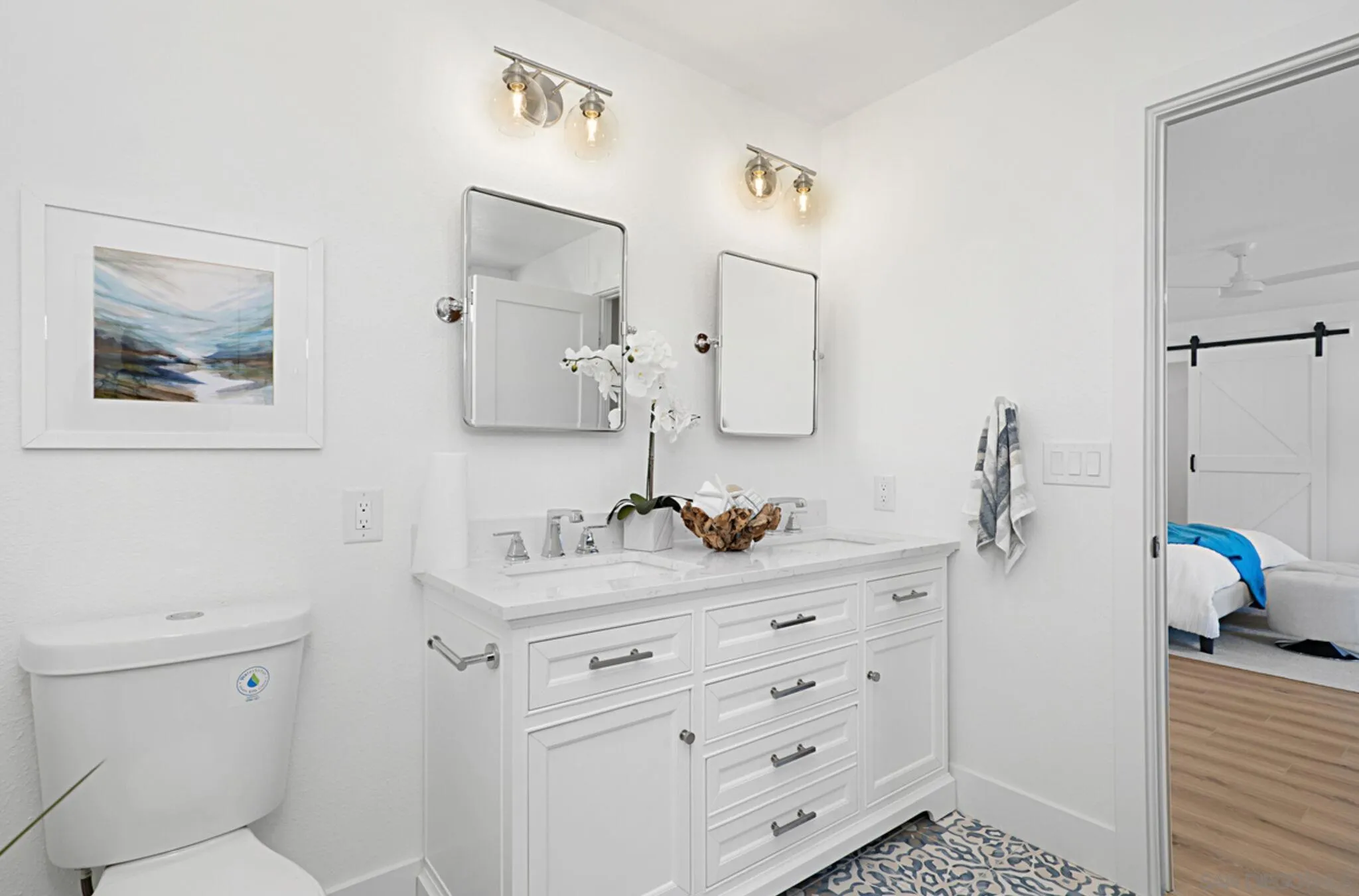 2282 Morgan Road Carlsbad, CA 92008 - Photo 16 of 28 a bathroom with a sink toilet and mirror