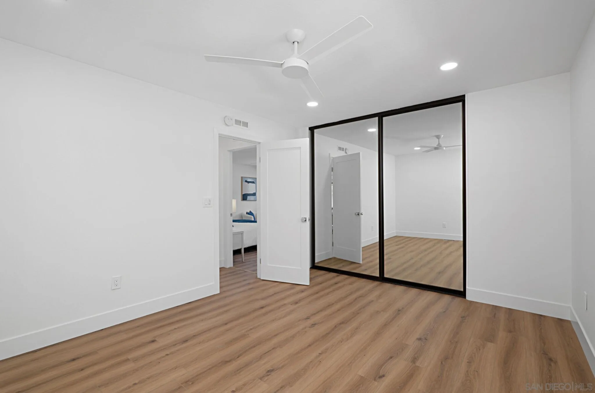 2282 Morgan Road Carlsbad, CA 92008 - Photo 18 of 28 a view of empty room with wooden floor