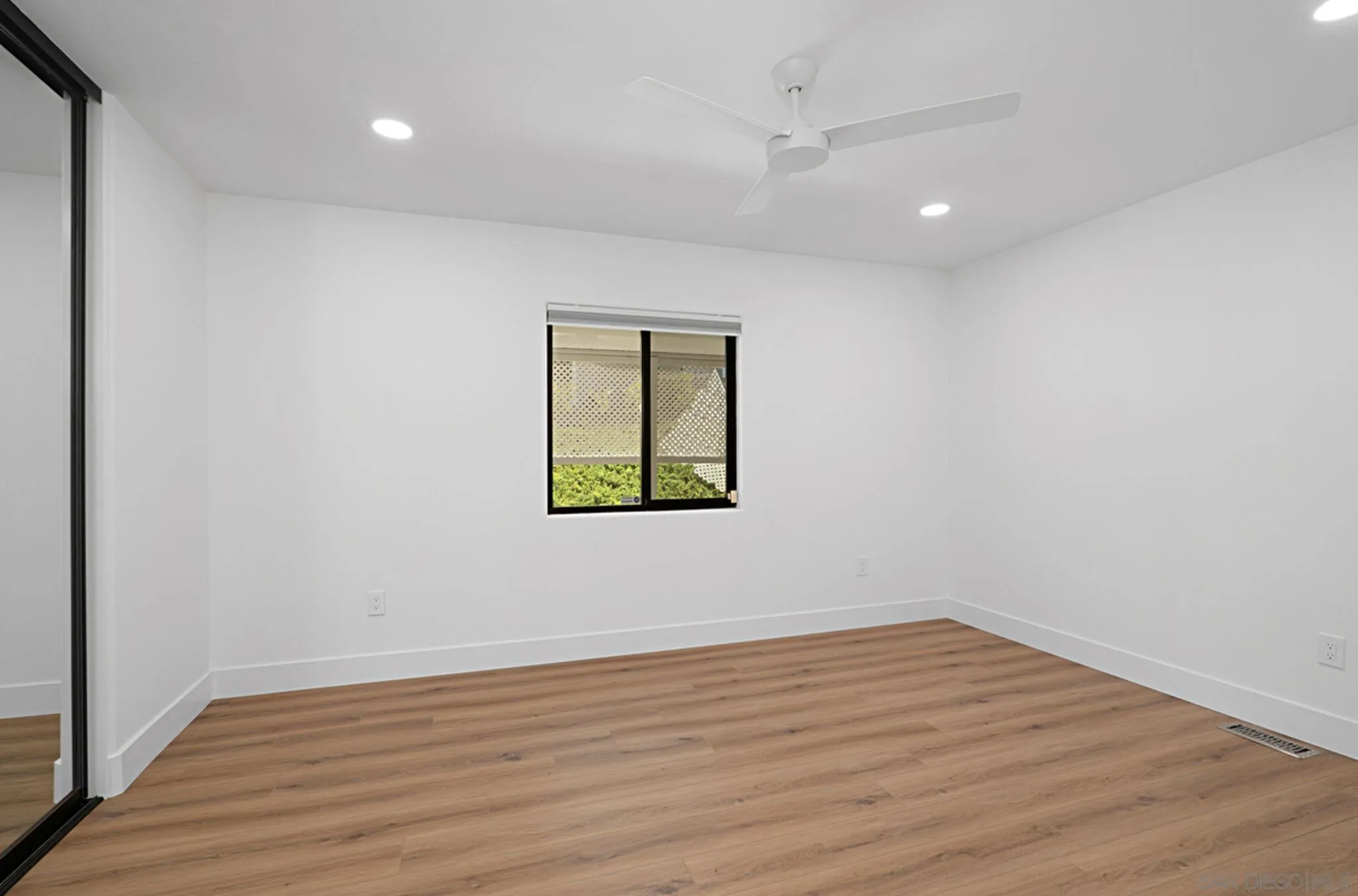 2282 Morgan Road Carlsbad, CA 92008 - Photo 19 of 28 wooden floor in an empty room with a window