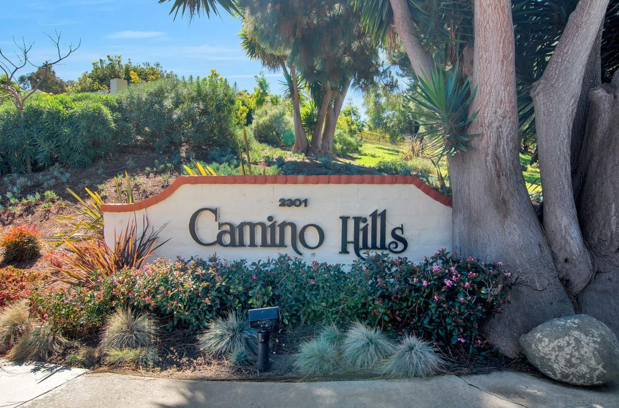 2282 Morgan Road Carlsbad, CA 92008 - Photo 25 of 28 a sign that is sitting in front of flowers