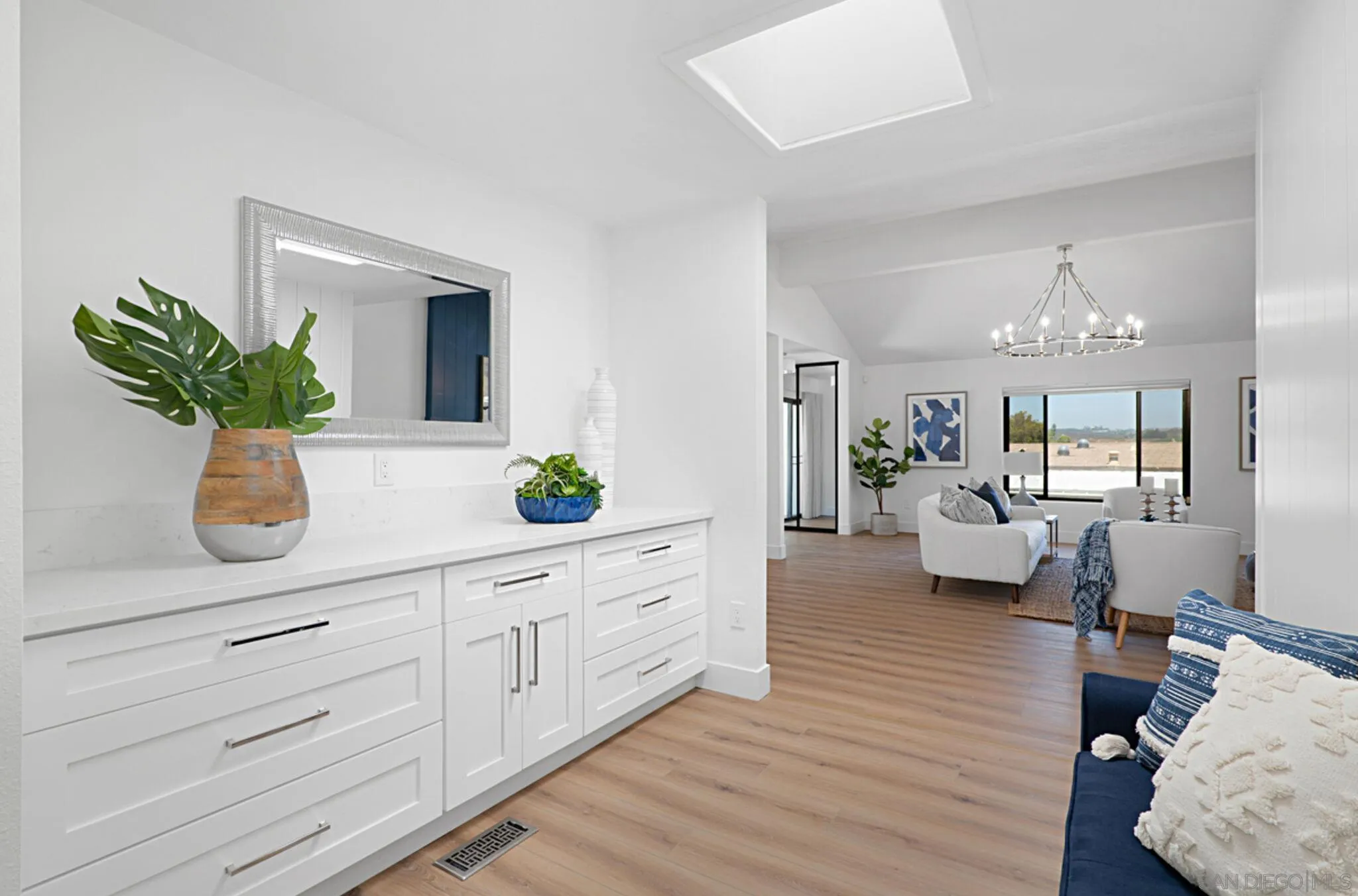 2282 Morgan Road Carlsbad, CA 92008 - Photo 6 of 28 a living room with furniture potted plant and kitchen view