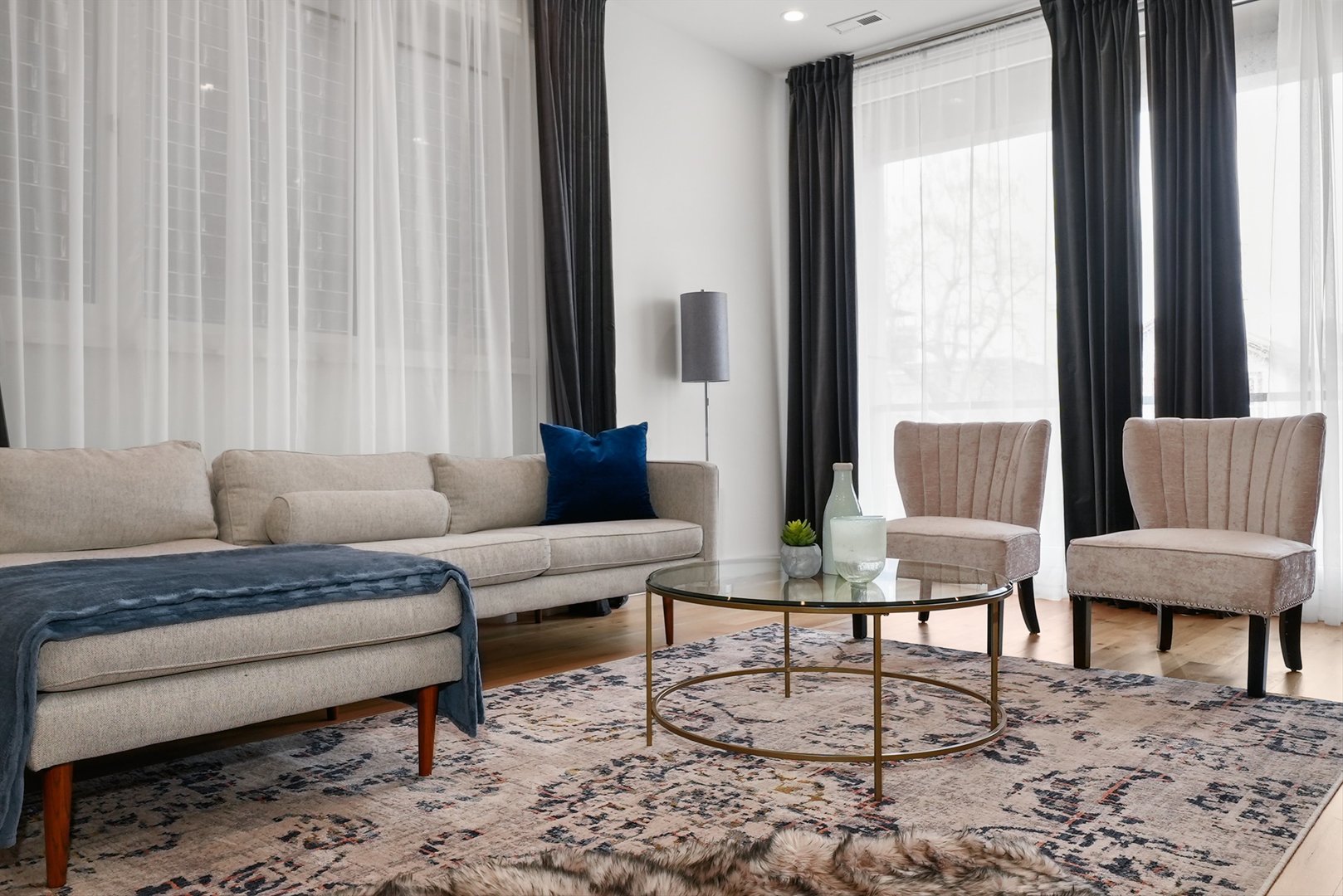 1605 West Ohio Street, Unit 2 Chicago, IL 60622 - Photo 16 of 38 a living room with furniture and a large window