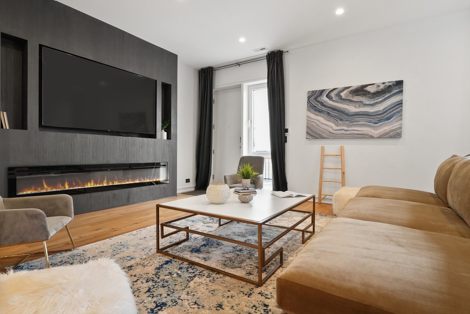 1605 West Ohio Street, Unit 2 Chicago, IL 60622 - Photo 24 of 38 a living room with furniture and a flat screen tv