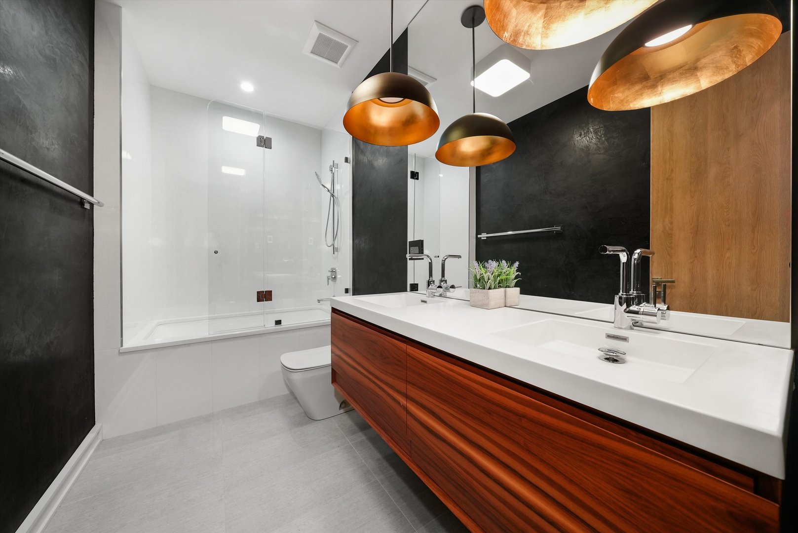 1605 West Ohio Street, Unit 2 Chicago, IL 60622 - Photo 33 of 38 a bathroom with a sink a light fixture and a mirror