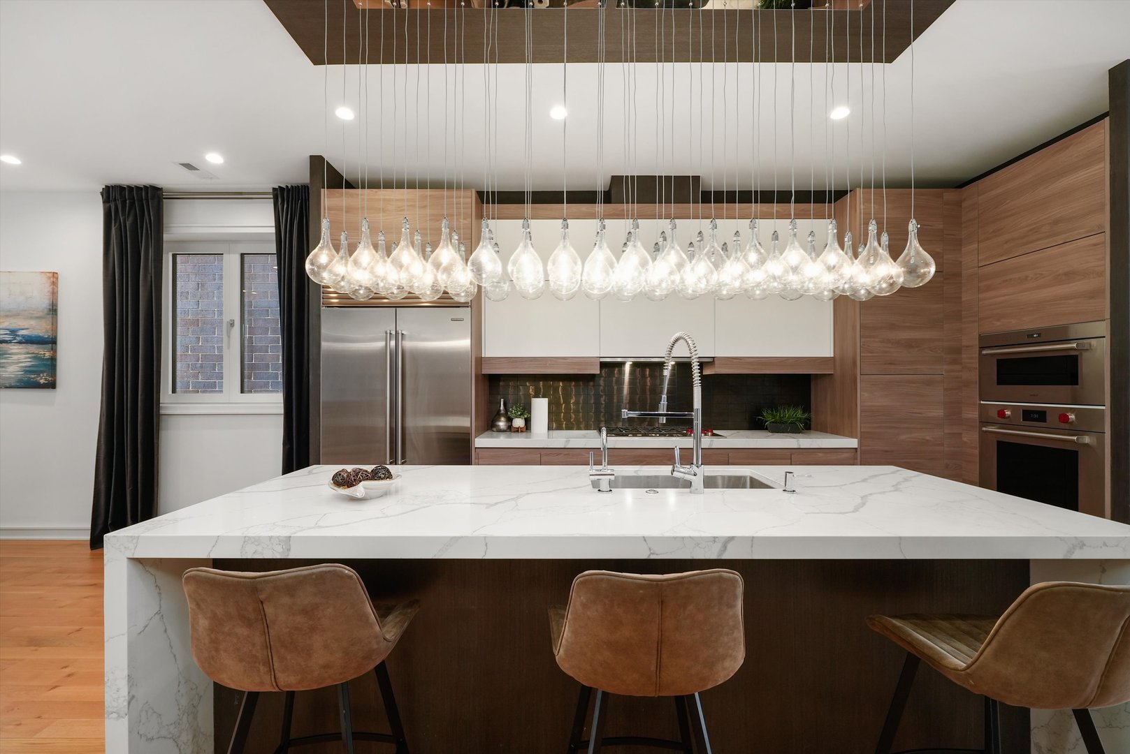 1605 West Ohio Street, Unit 2 Chicago, IL 60622 - Photo 7 of 38 a kitchen with a table and chairs in it