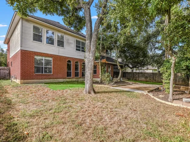 a house with trees in the background