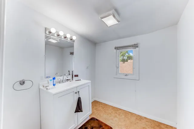 a utility room with cabinets dryer and washer