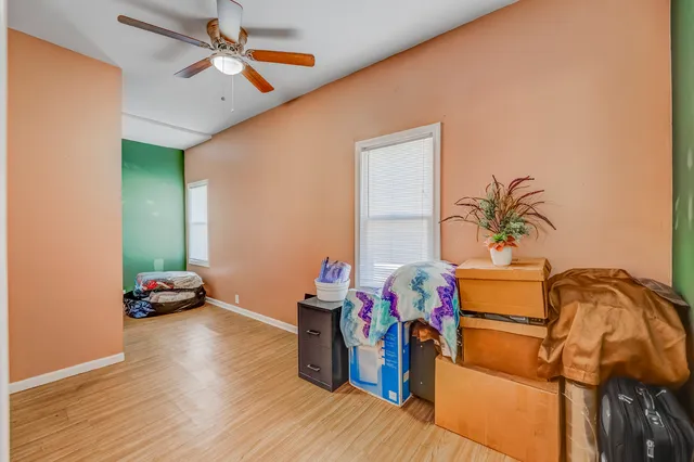a bedroom with furniture and a window