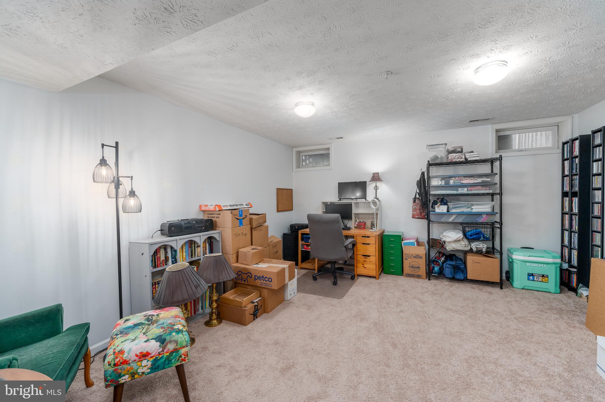8303 Spadderdock Way Laurel, MD 20724 - Photo 18 of 25 a living room with furniture and a flat screen tv
