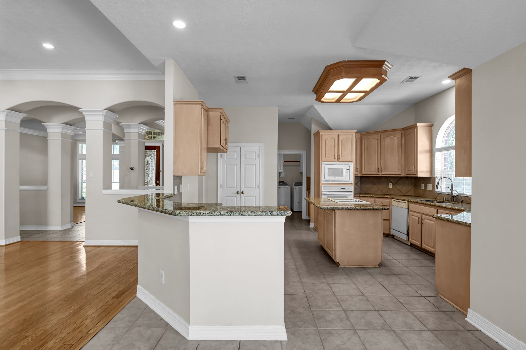 16214 Lobo Lane Spring, TX 77379 - Photo 8 of 25 Kitchen and Breakfast Bar open to Livingroom