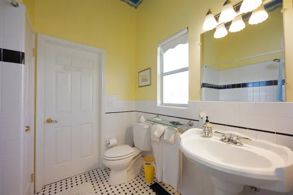 a bathroom with a sink a mirror and a shower