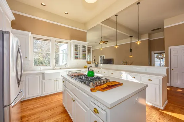 a kitchen with lot of counter space and appliances